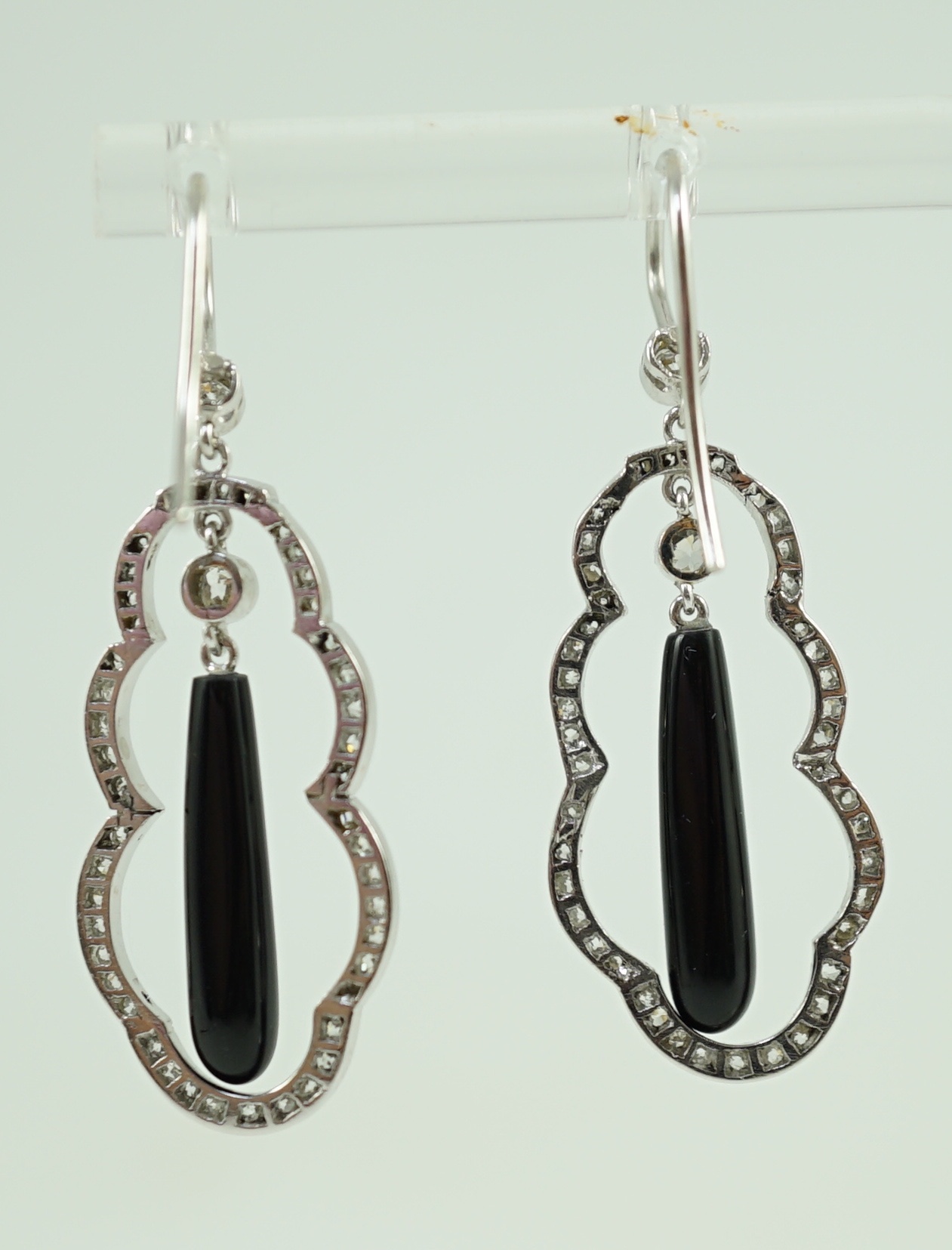 A pair of 20th century white gold, black onyx and diamond cluster set drop earrings
